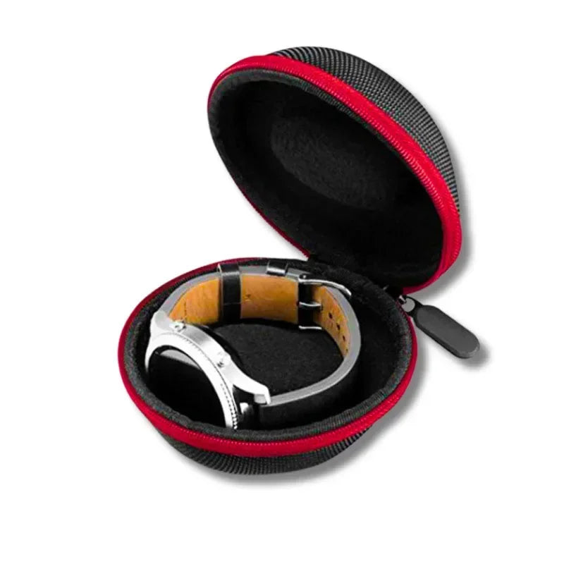 Compact round watch protective travel case with black interior and red zipper trim, displaying a wristwatch inside